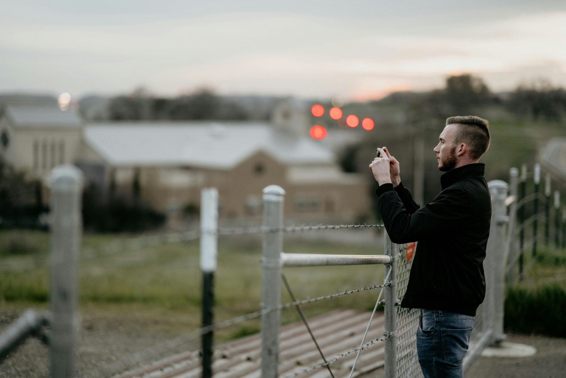 Man taking photo at sunset