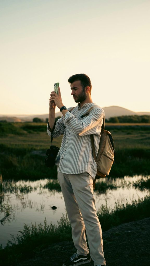 Person taking a photo outdoors